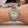 Elegant Cartier watch on wrist.