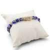 Blue bracelet on a soft pillow