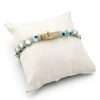 Elegant bracelet on a display cushion.