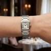 Silver Cartier watch on wrist