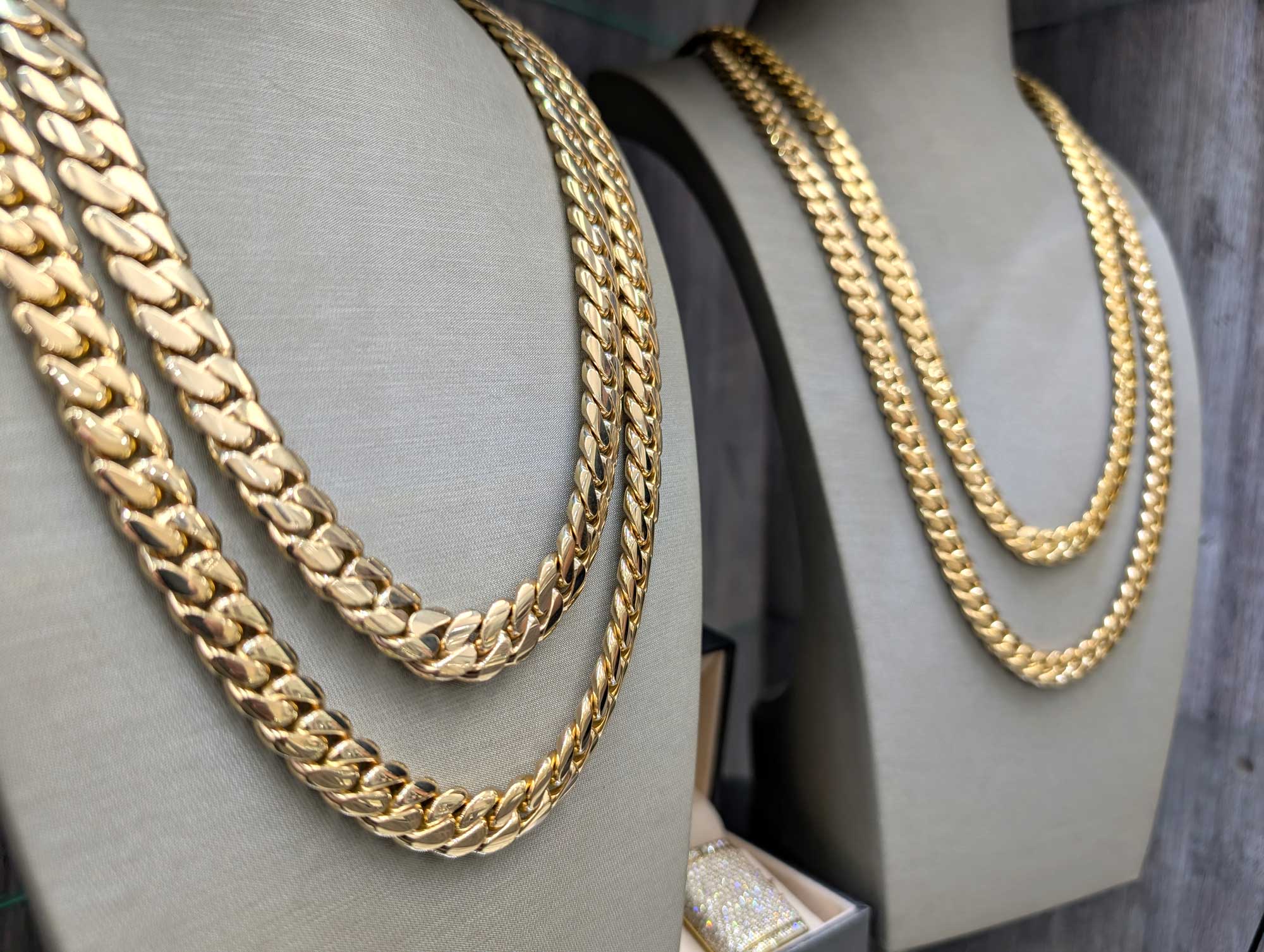 Handmade Miami Cuban Link Chains | Grimal Jewelry 1 Three gold Cuban link chains displayed