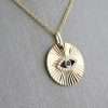 Gold necklace with eye pendant