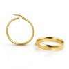 Two gold hoop earrings displayed elegantly