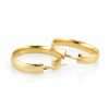 Gold hoop earrings on white background