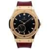 Gold watch with black dial
