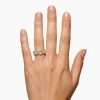 Hand wearing a diamond ring.